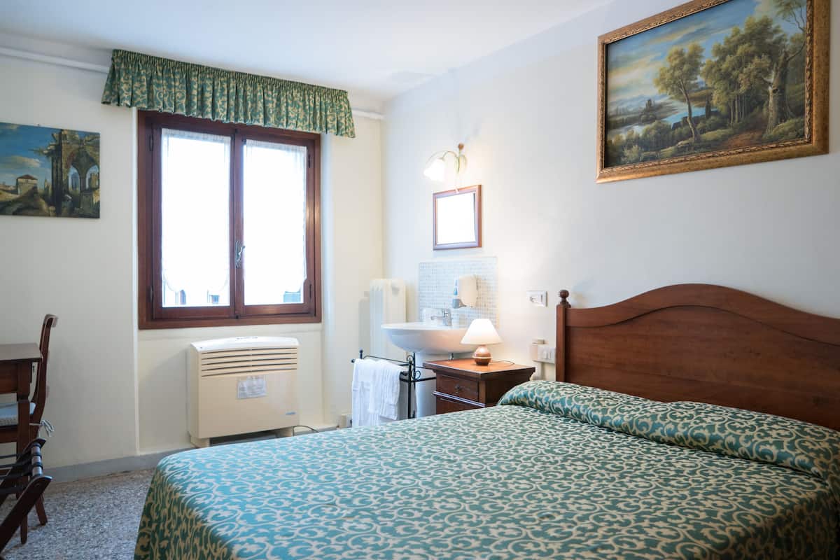 Economy Double Room, Shared Bathroom | In-room safe, blackout drapes, soundproofing, iron/ironing board