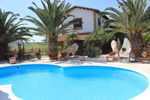 Outdoor pool, pool umbrellas, pool loungers