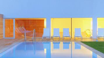 Indoor pool, outdoor pool, pool umbrellas, sun loungers