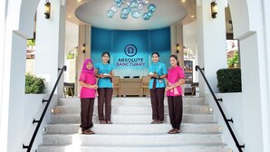 A hotel entrance with a blue backdrop and a sign reading "ABSOLUTE SANCTUARY". - Absolute Sanctuary (Koh Samui)