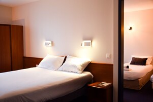 Family Room | Premium bedding, pillowtop beds, individually decorated, desk