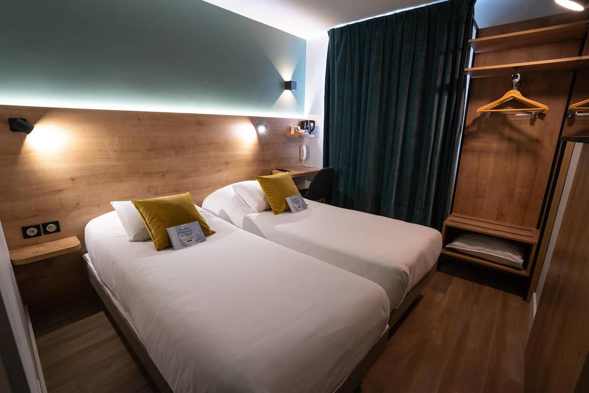 Premium bedding, desk, laptop workspace, blackout drapes