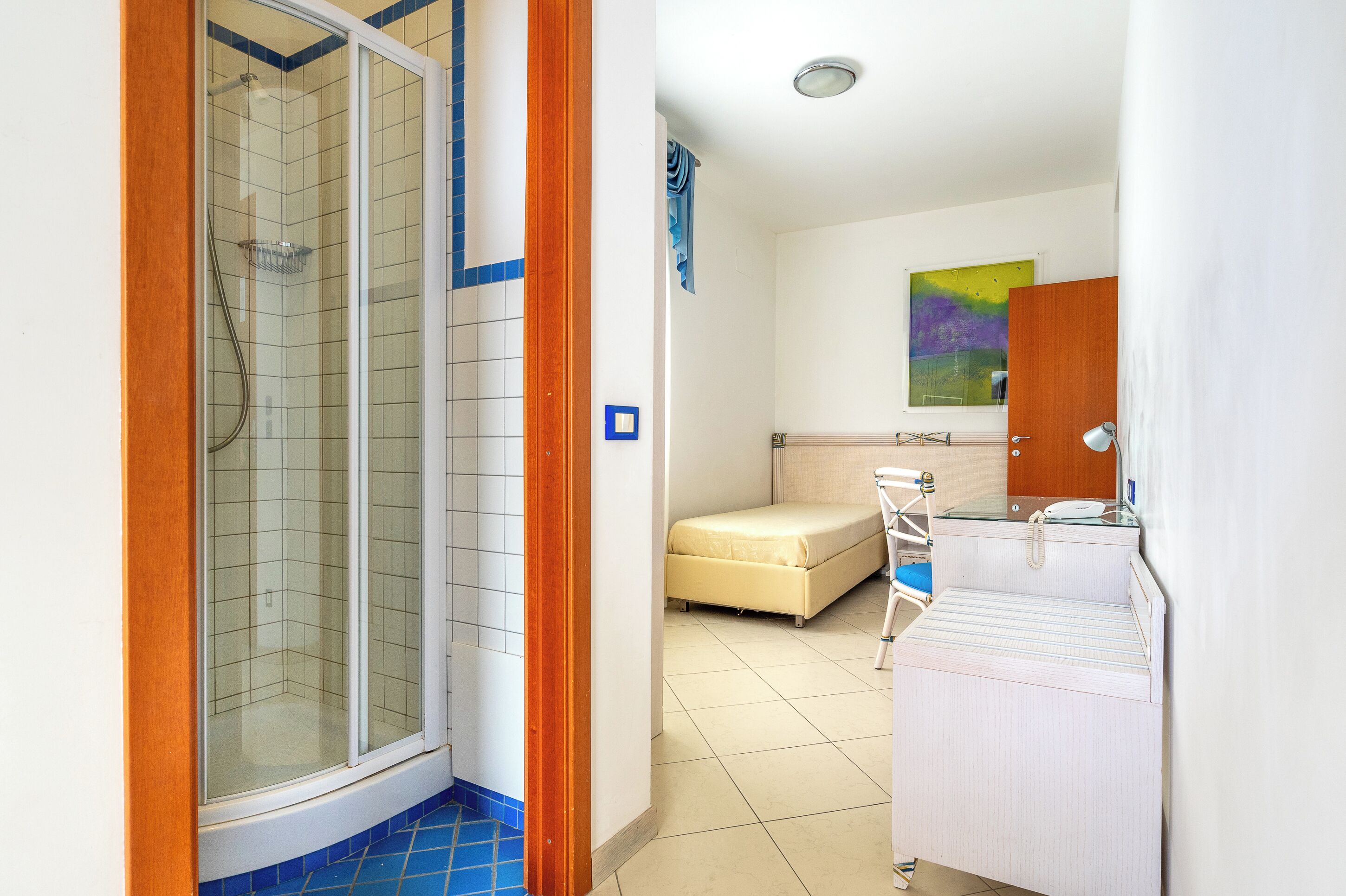 family room | 1 bedroom, minibar, in-room safe, desk