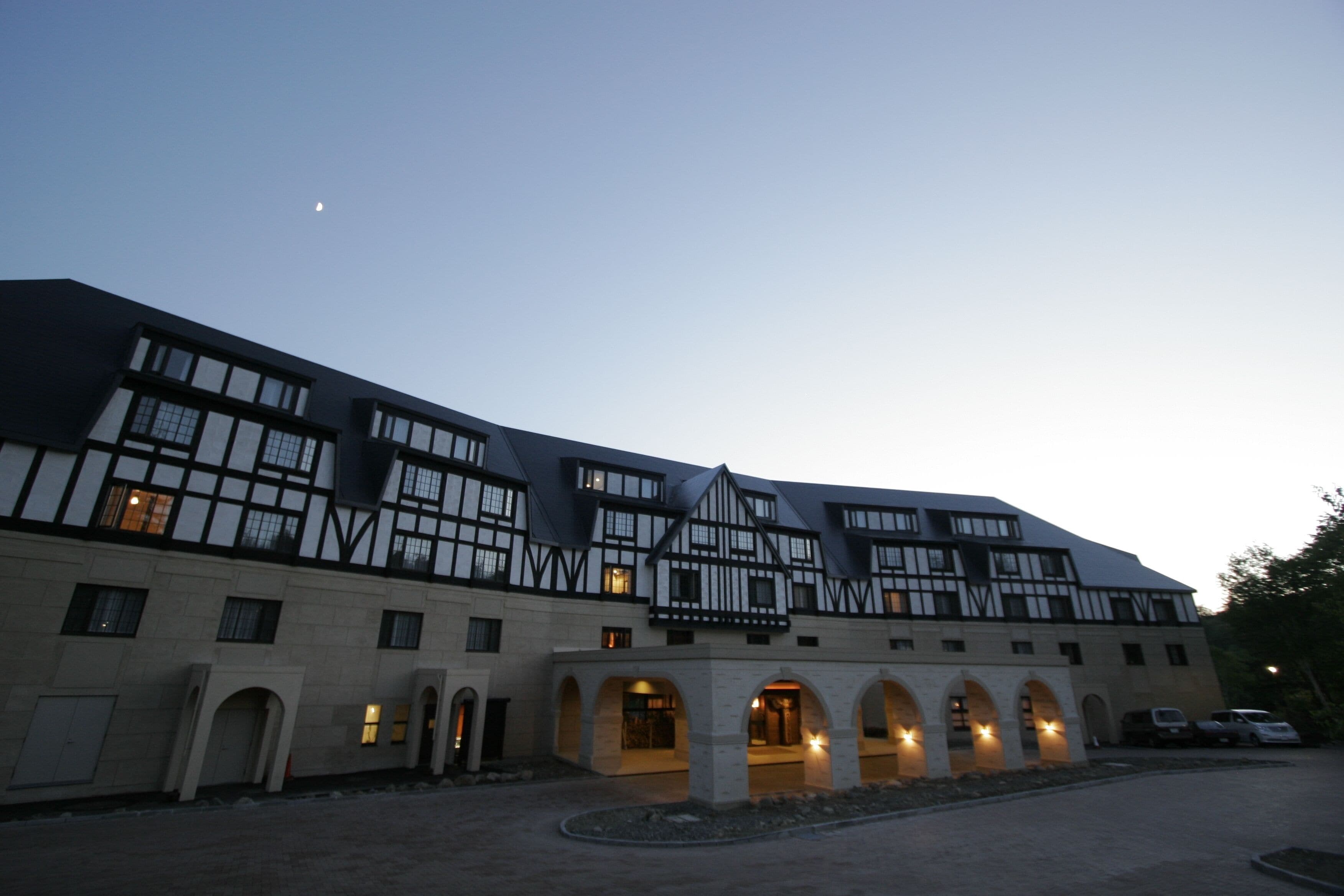 A large building with multiple windows and a courtyard.