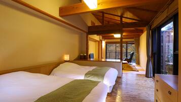 A hotel room with two beds, a wooden ceiling, a window with curtains, and a wooden dresser.