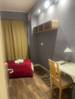 Habitación Business individual | Sábanas de algodón egipcio y ropa de cama de alta calidad