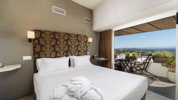 Luxe studio suite | Een minibar, individueel gedecoreerd, individueel gemeubileerd