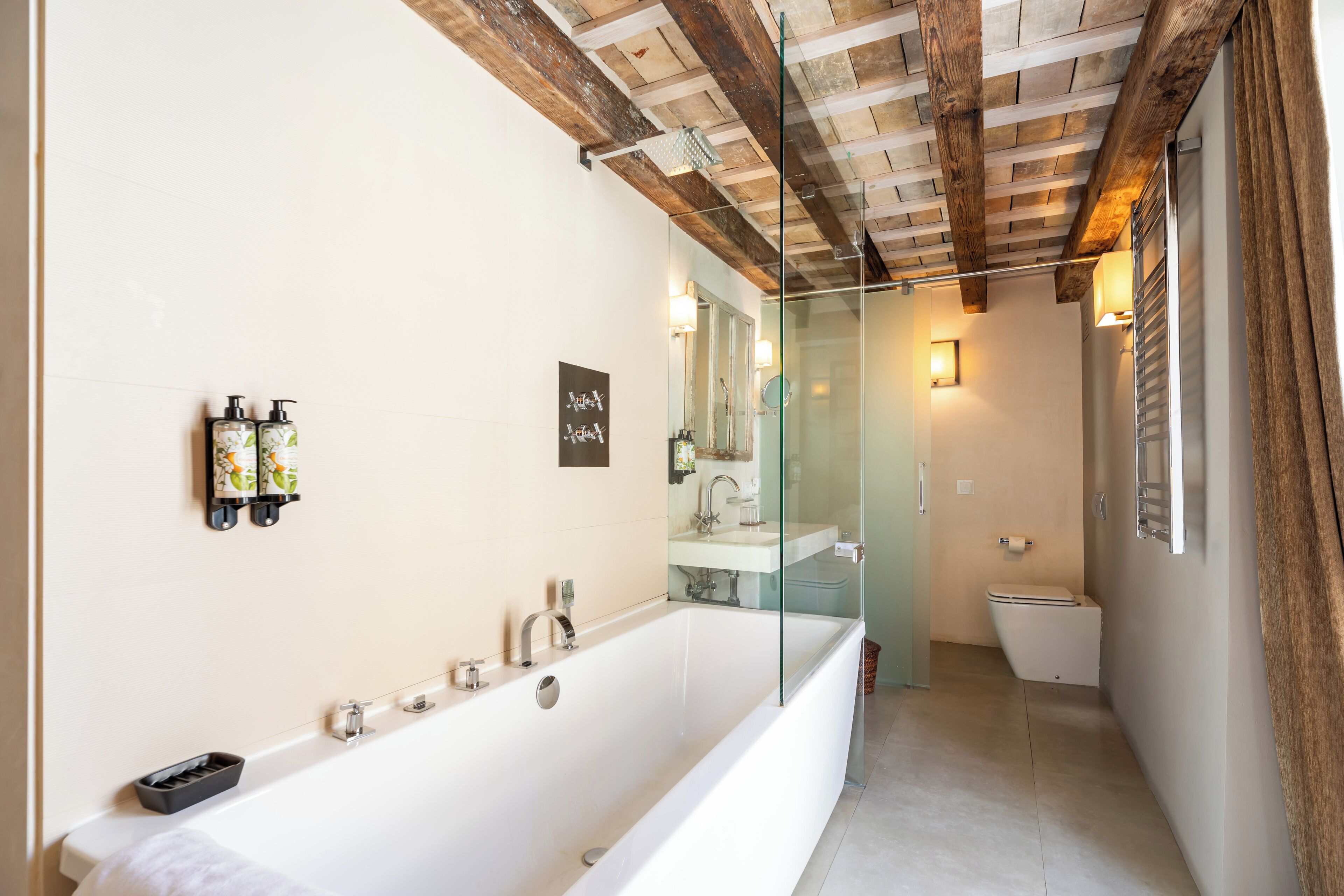 designer toiletries, hair dryer, bathrobes, slippers