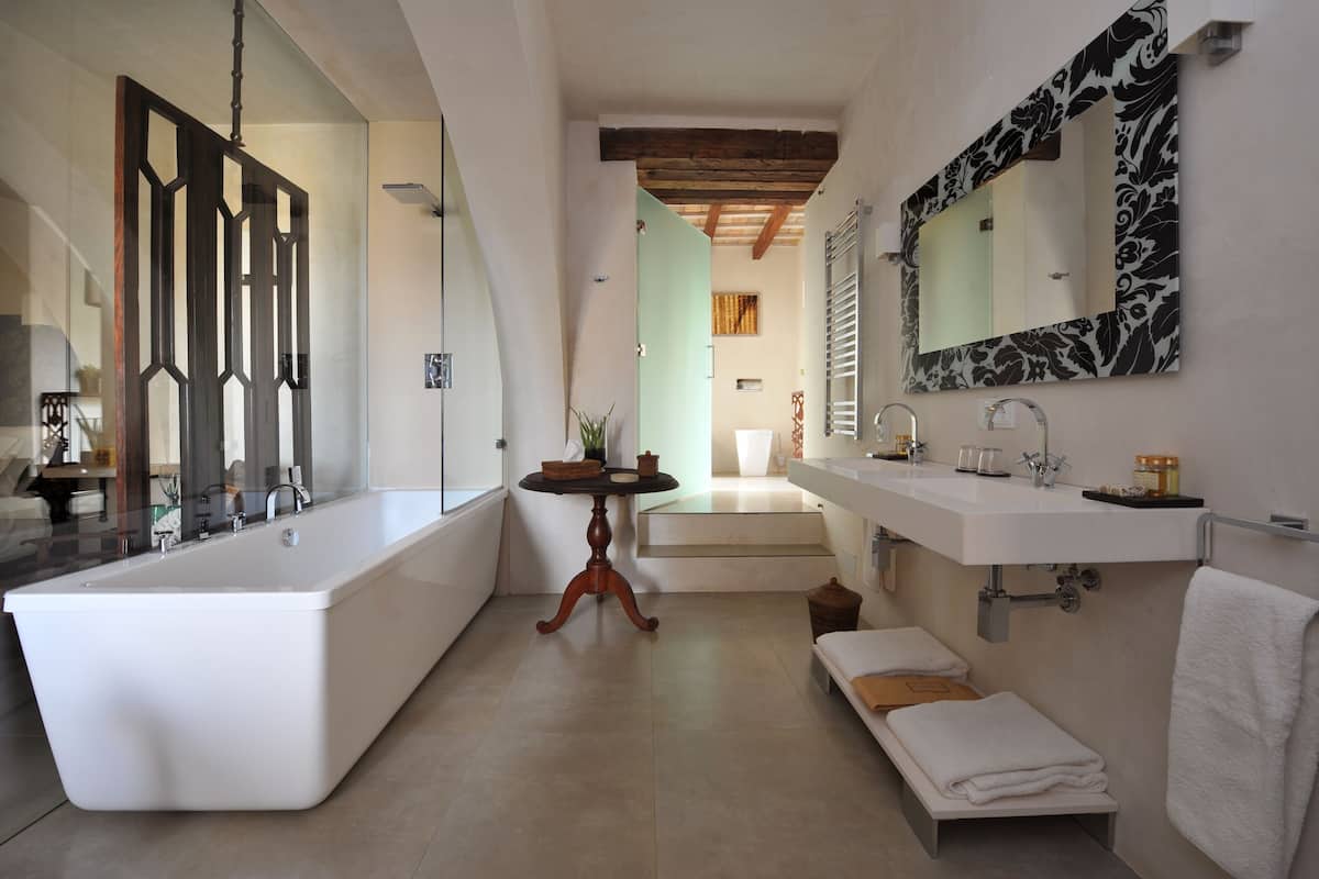 designer toiletries, hair dryer, bathrobes, slippers