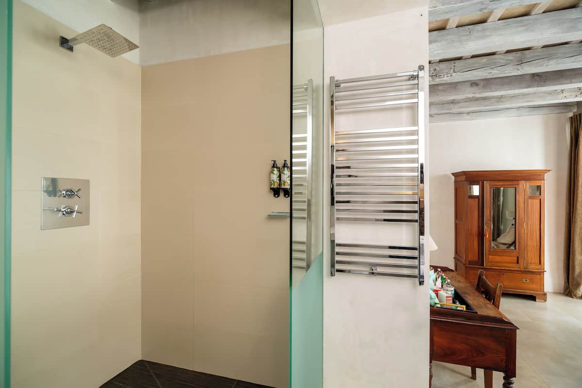 designer toiletries, hair dryer, bathrobes, slippers