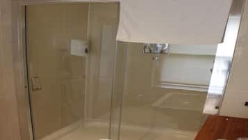 Shower, rainfall showerhead, hair dryer, towels