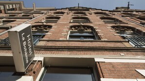 A hotel facade with multiple windows and a sign reading "Hotel La Bohême". - La Boheme (Amsterdam)