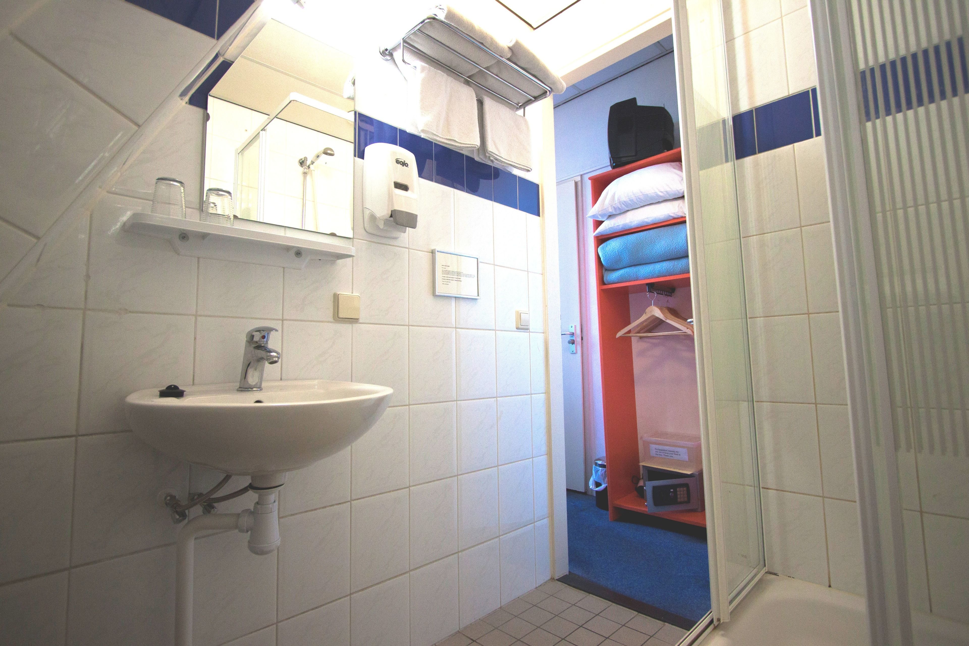 standard room, 1 queen bed | bathroom | hair dryer, towels