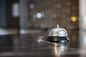 A hotel room with a polished wooden floor and a reflective surface. - A-Sport Hotel (Brno)