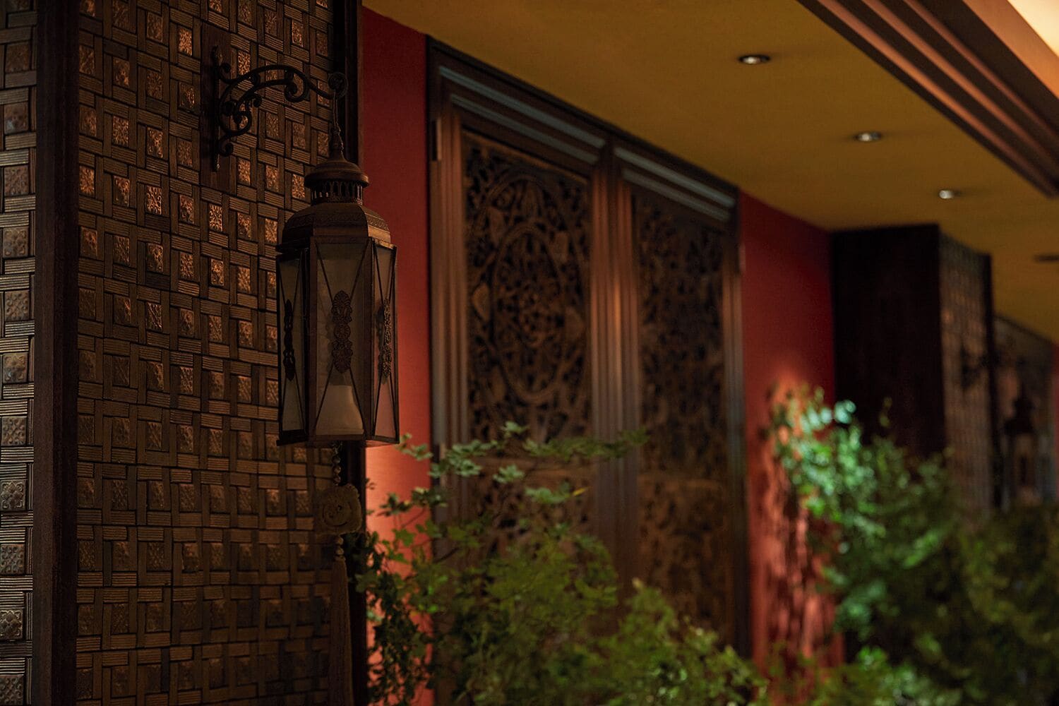 A traditional building facade with intricate brickwork and decorative panels.