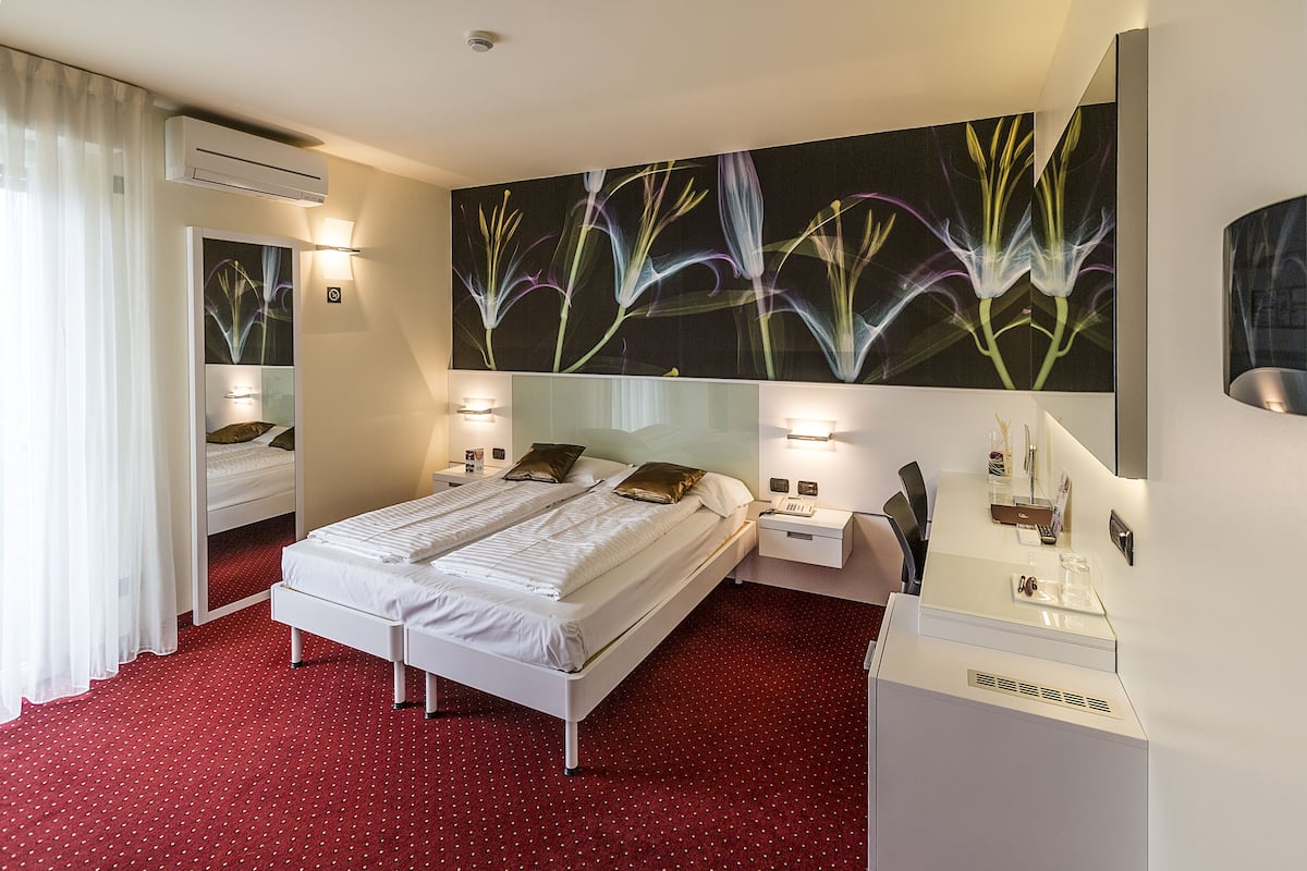 Exclusive Room, Partial Lake View | In-room safe, desk, laptop workspace, blackout drapes