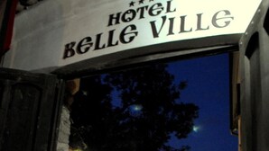 The entrance to Hotel Belle Ville with a stone facade and a sign above the door. - Belle Ville (Plovdiv)