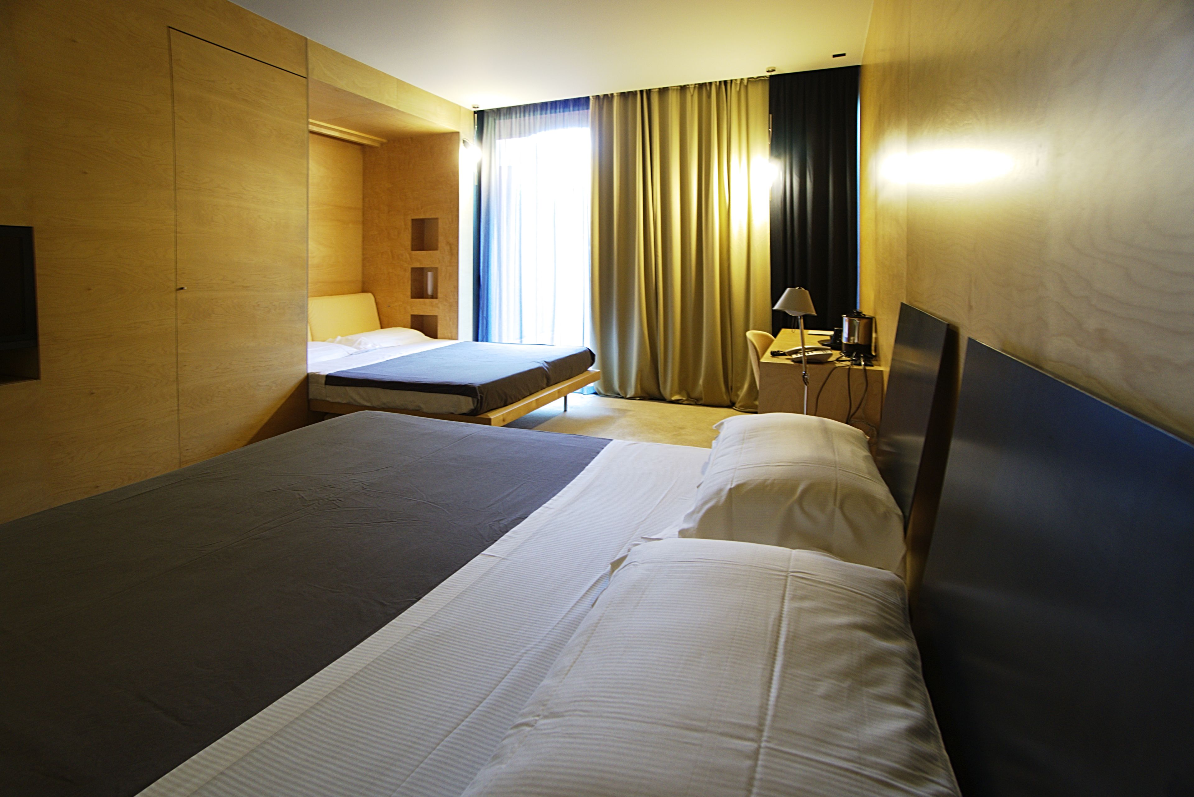 superior quadruple room, annex building | premium bedding, down duvets, in-room safe, desk