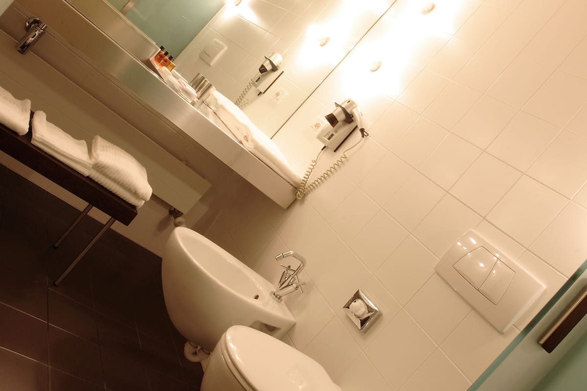 superior quadruple room, annex building | bathroom | designer toiletries, hair dryer, bidet, towels