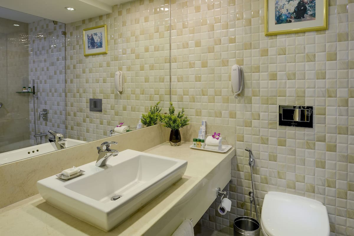 superior room | bathroom | shower, free toiletries, hair dryer, bathrobes