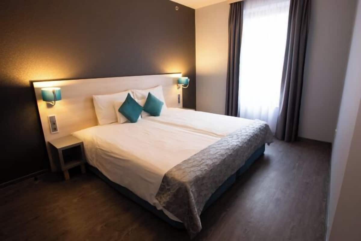 1 habitación, ropa de cama de alta calidad y minibar