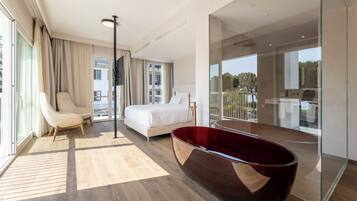 Deluxe Suite, Lake View | Minibar, in-room safe, desk, laptop workspace