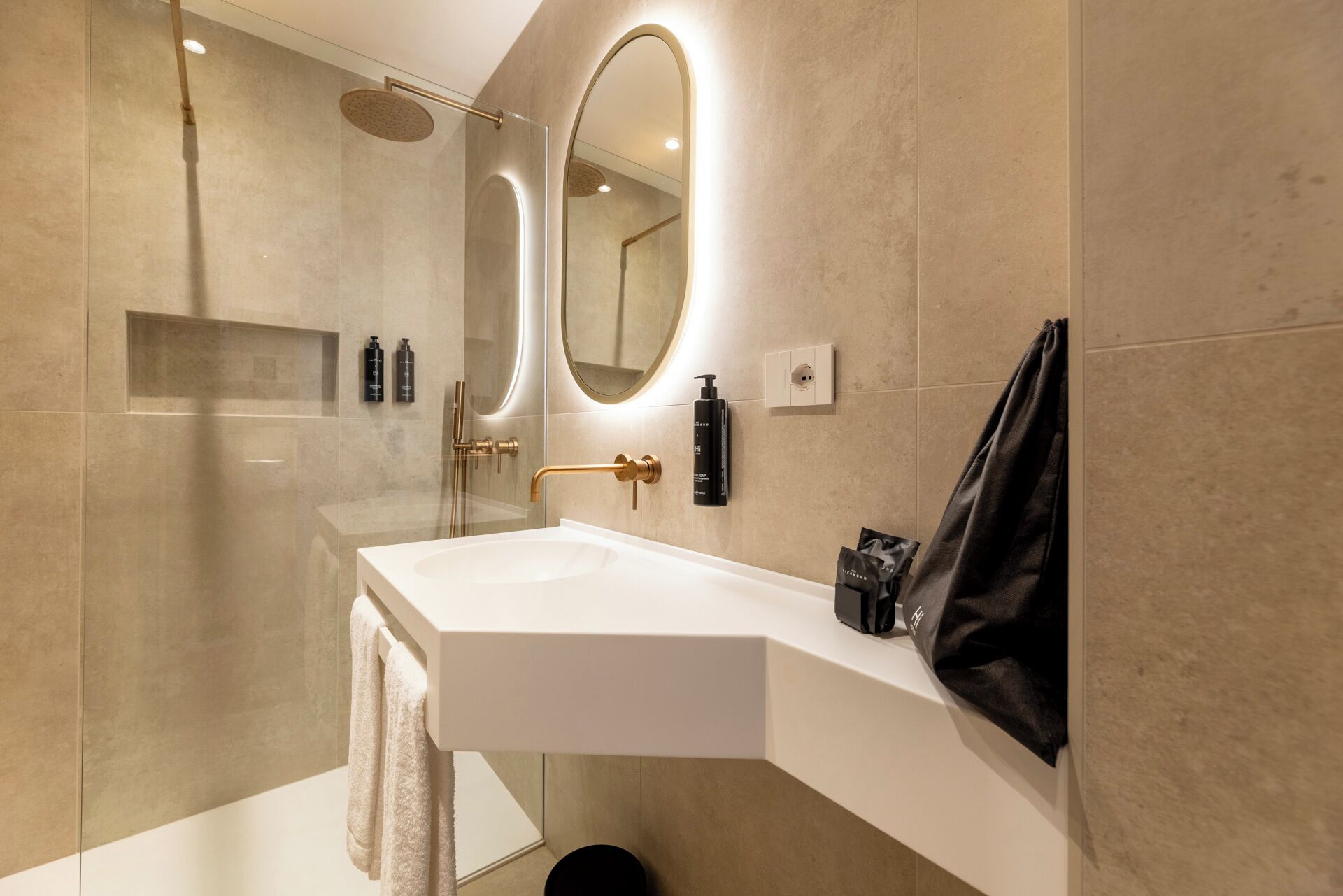 bathtub, hair dryer, towels, soap