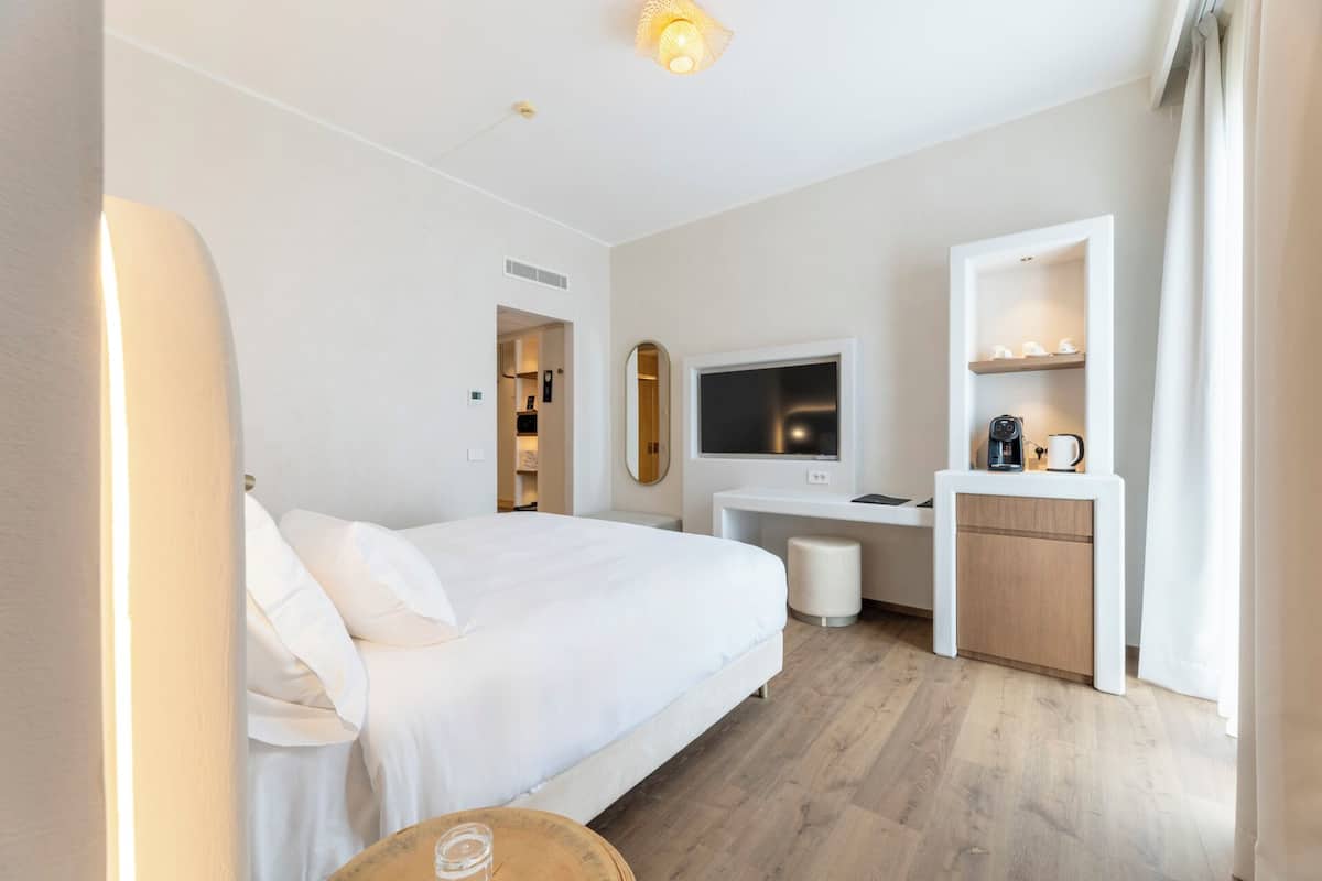 Deluxe Room, Partial Lake View | Minibar, in-room safe, desk, laptop workspace