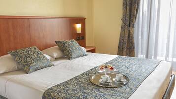 Premium bedding, down comforters, in-room safe, desk