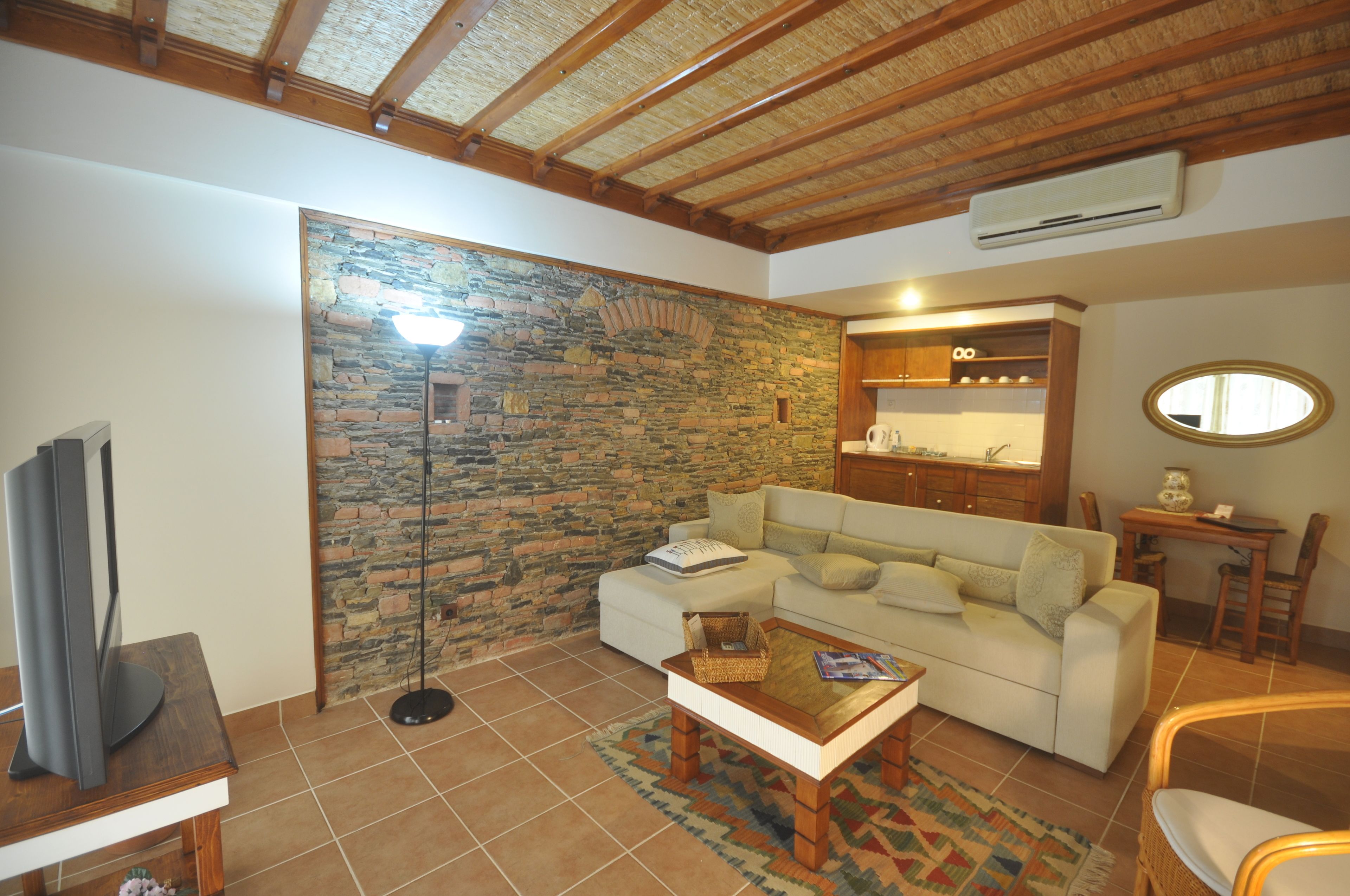 suite, garden view | living area | 82-cm lcd tv with satellite channels, tv