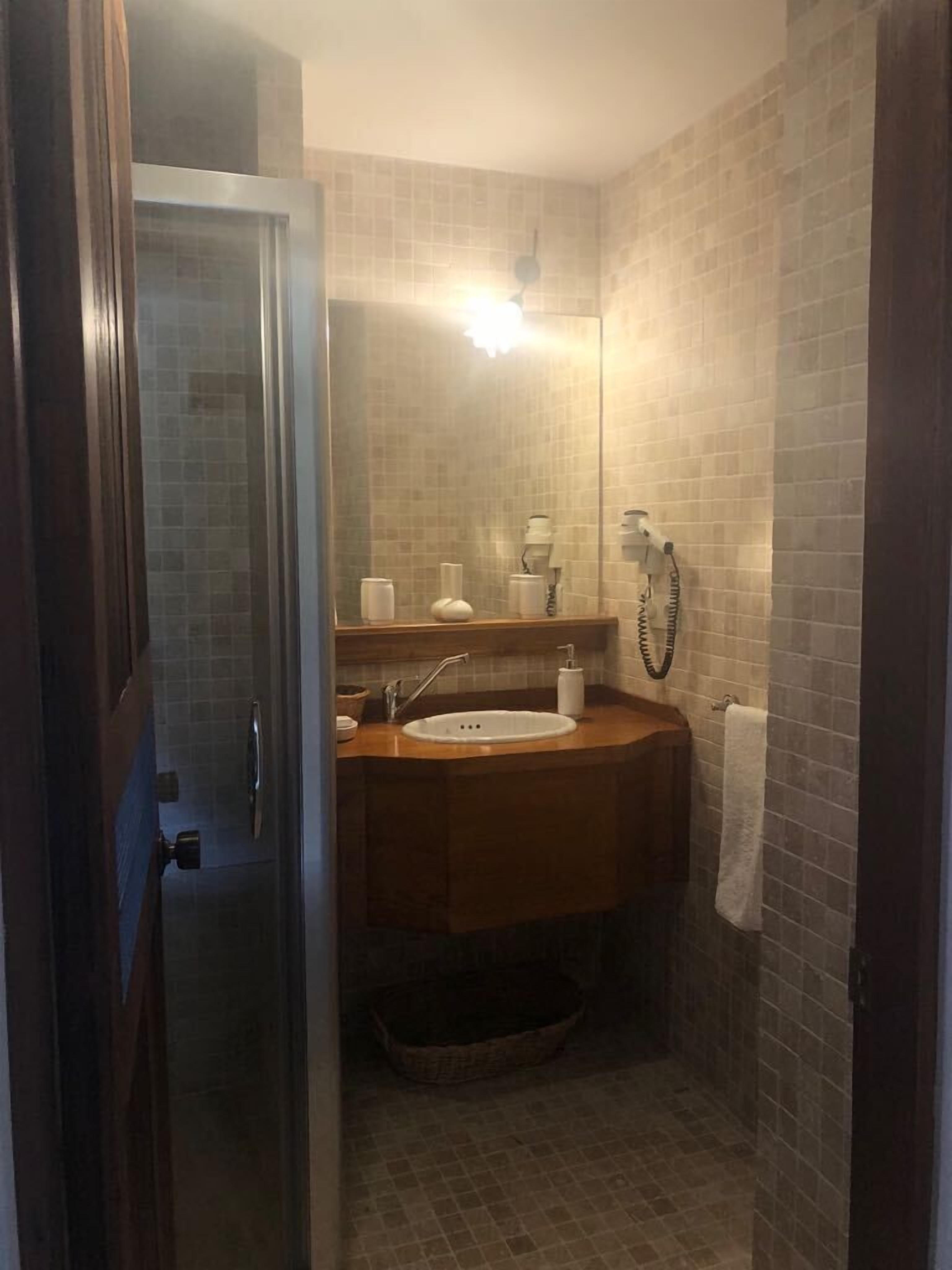 deluxe suite, 1 king bed with sofa bed, french balcony | bathroom | shower, free toiletries, hair dryer, bathrobes