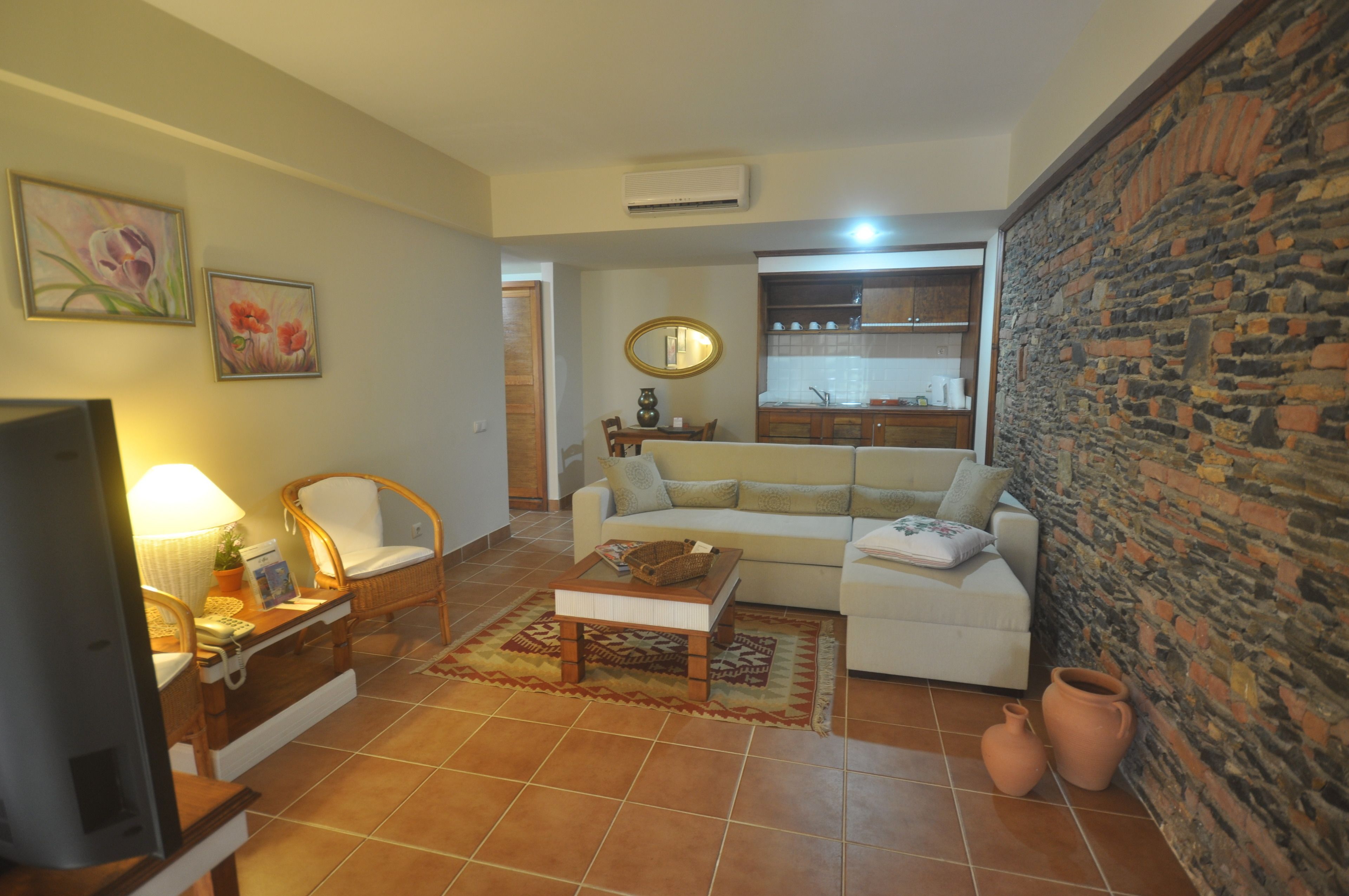 suite, garden view | living area | 82-cm lcd tv with satellite channels, tv