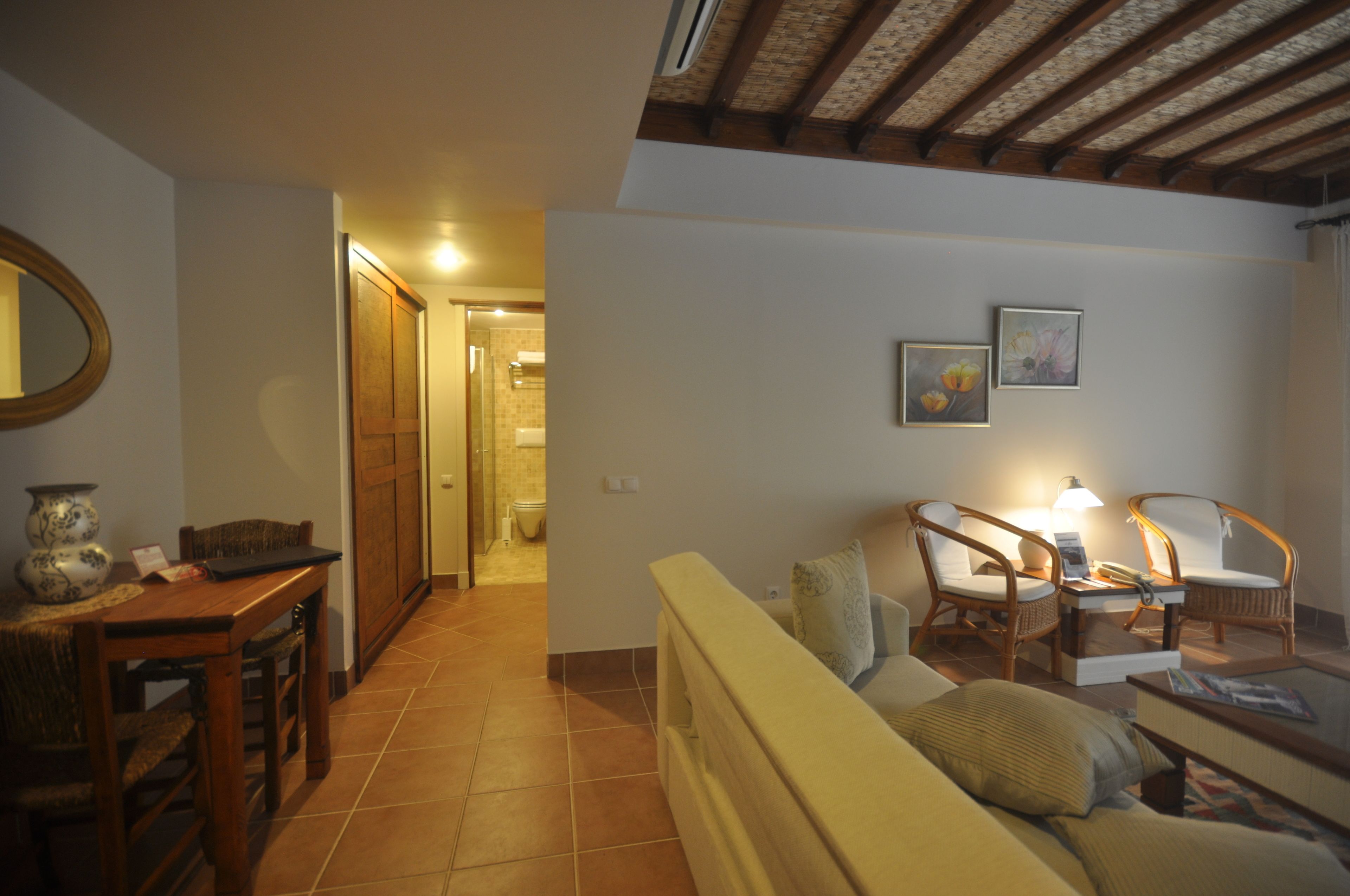 suite, garden view | living area | 82-cm lcd tv with satellite channels, tv
