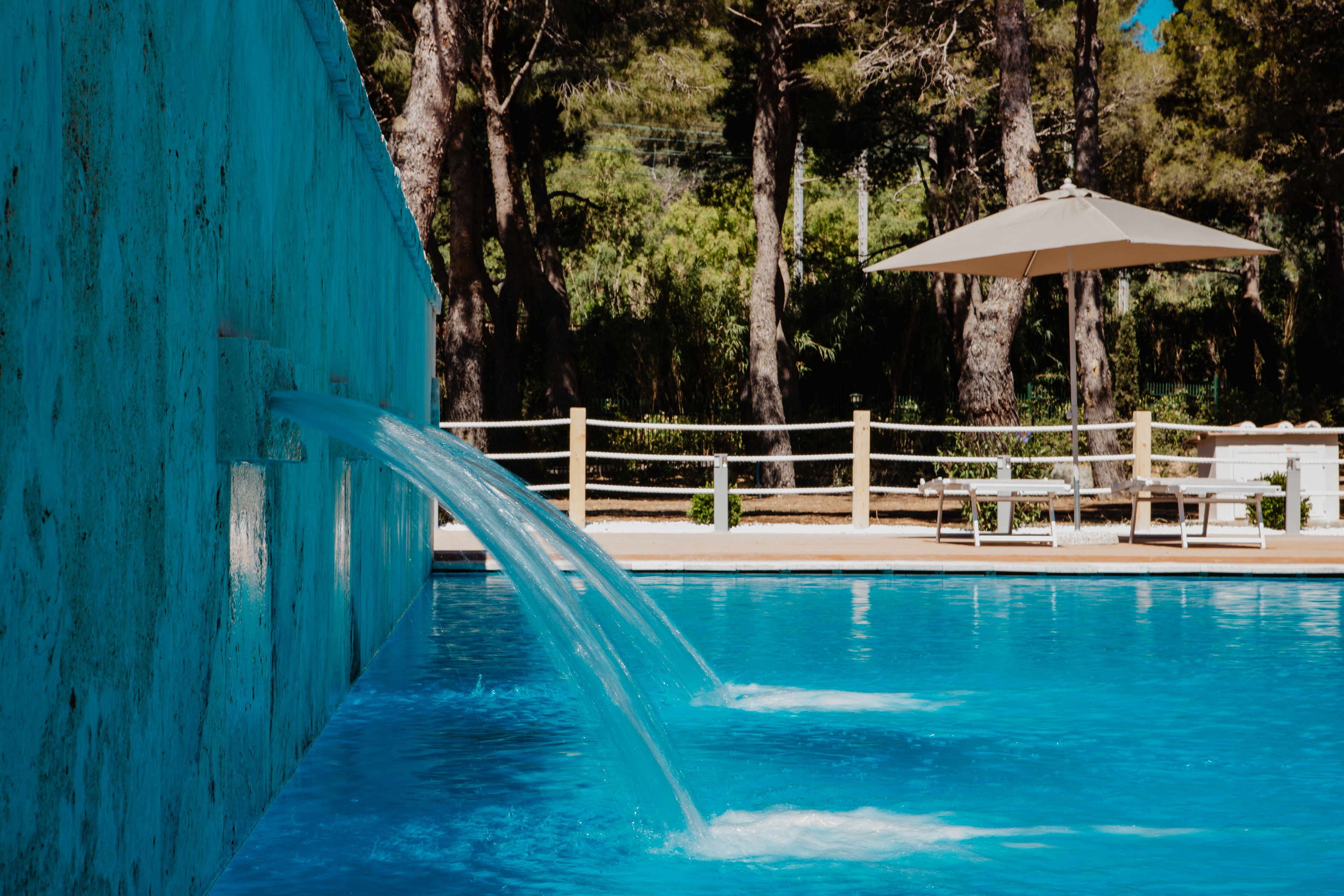 seasonal outdoor pool, pool umbrellas, pool loungers