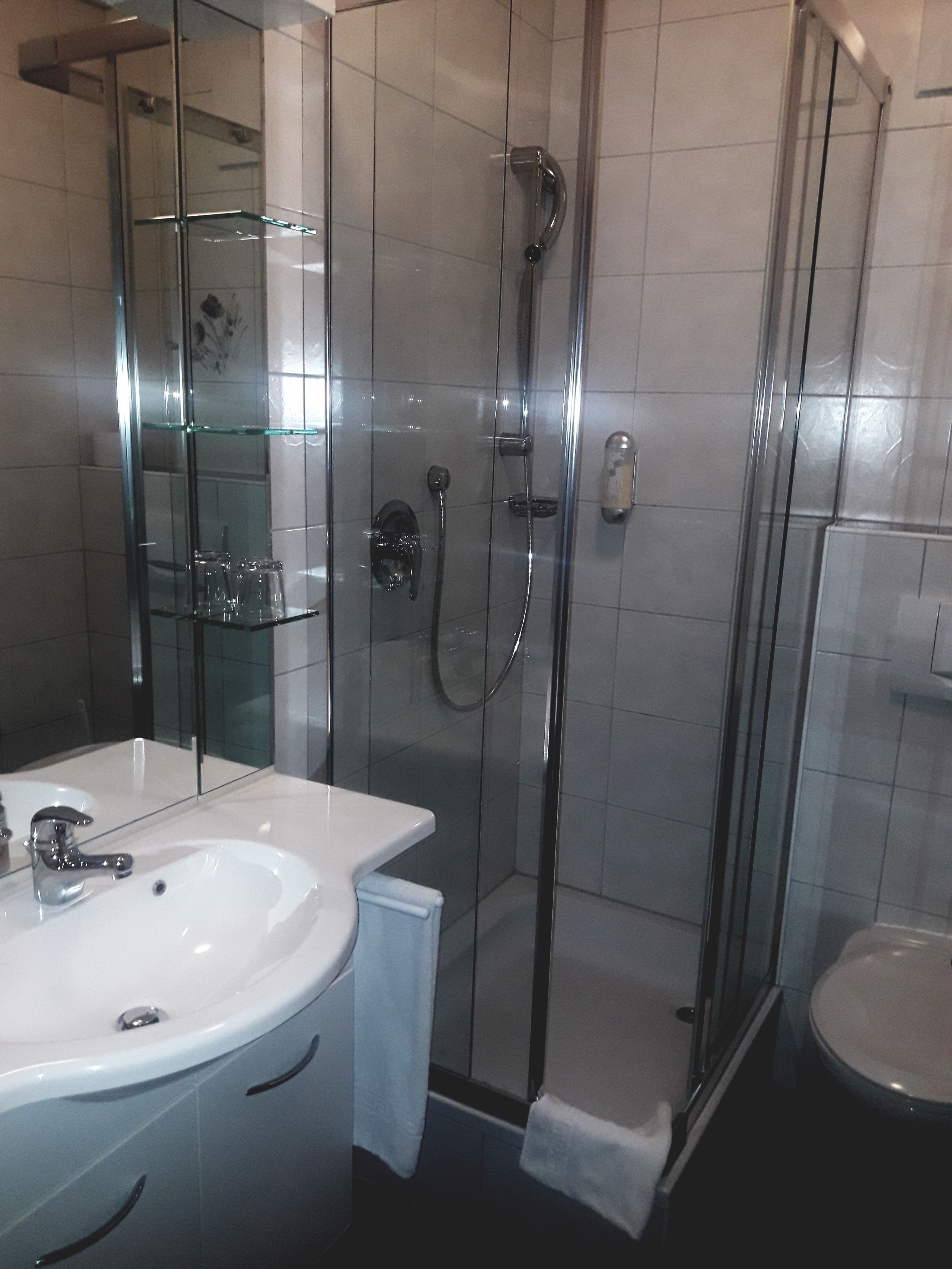 suite for single occupany | bathroom | hair dryer, towels