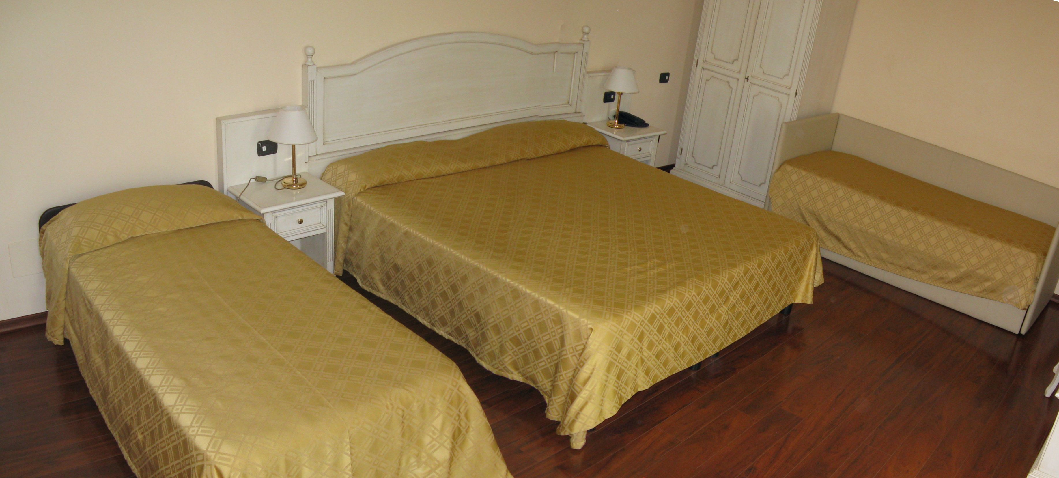 superior quadruple room | minibar, in-room safe, desk, blackout curtains