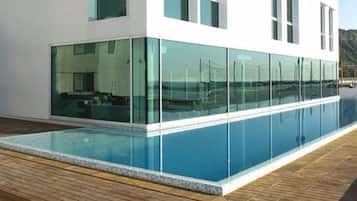 Outdoor pool, open 9:00 AM to 10:00 PM, pool umbrellas, pool loungers