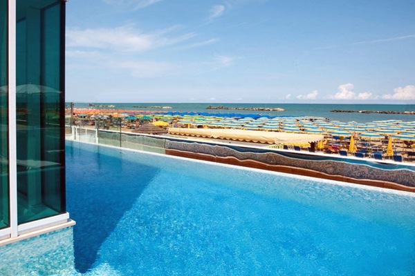Outdoor pool, open 9:00 AM to 10:00 PM, pool umbrellas, sun loungers