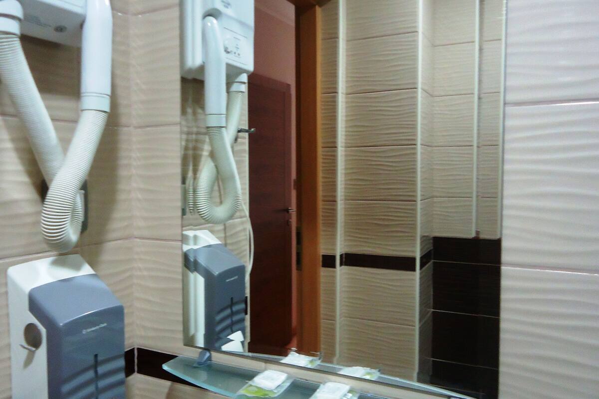 classic double room | bathroom | shower, free toiletries, hair dryer, slippers