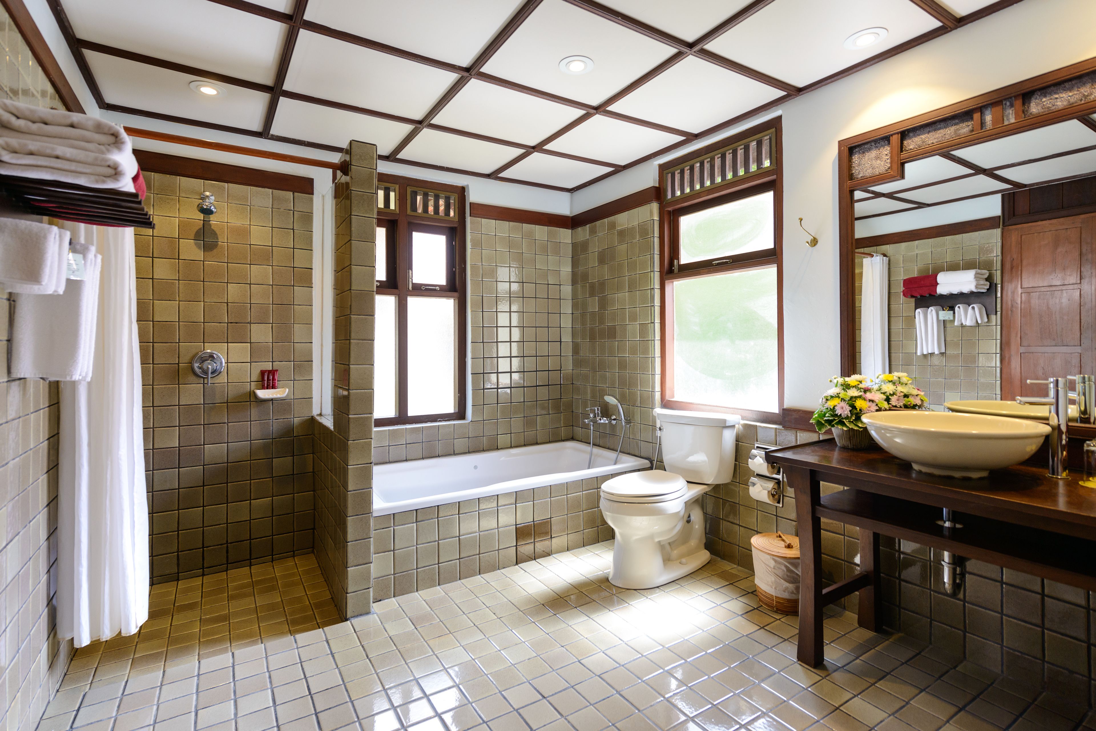 thai style deluxe | bathroom | separate bathtub and shower, free toiletries, hair dryer, bathrobes