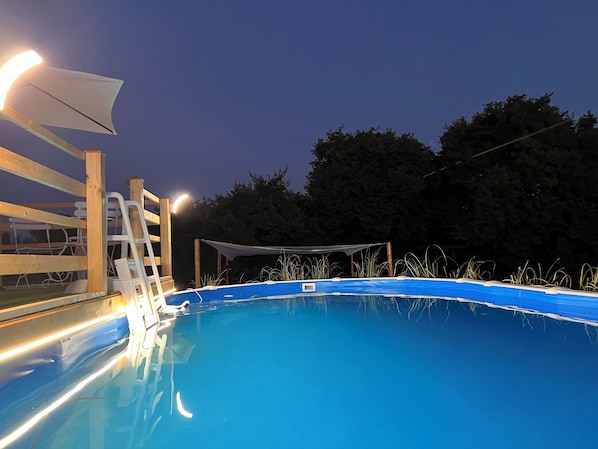 Seasonal outdoor pool, open 9:00 AM to 7:00 PM, pool umbrellas