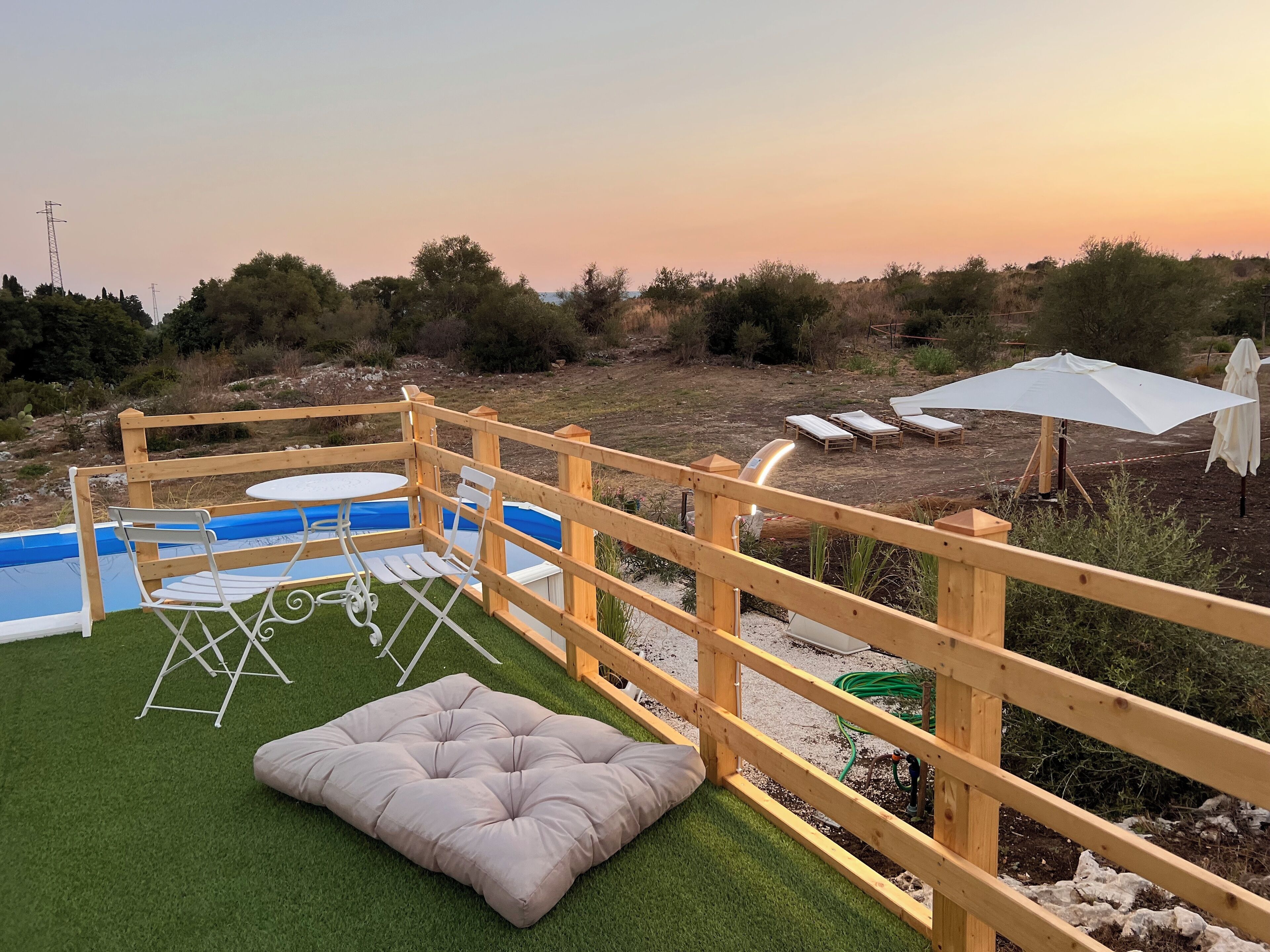 Seasonal outdoor pool, open 9:00 AM to 7:00 PM, pool umbrellas