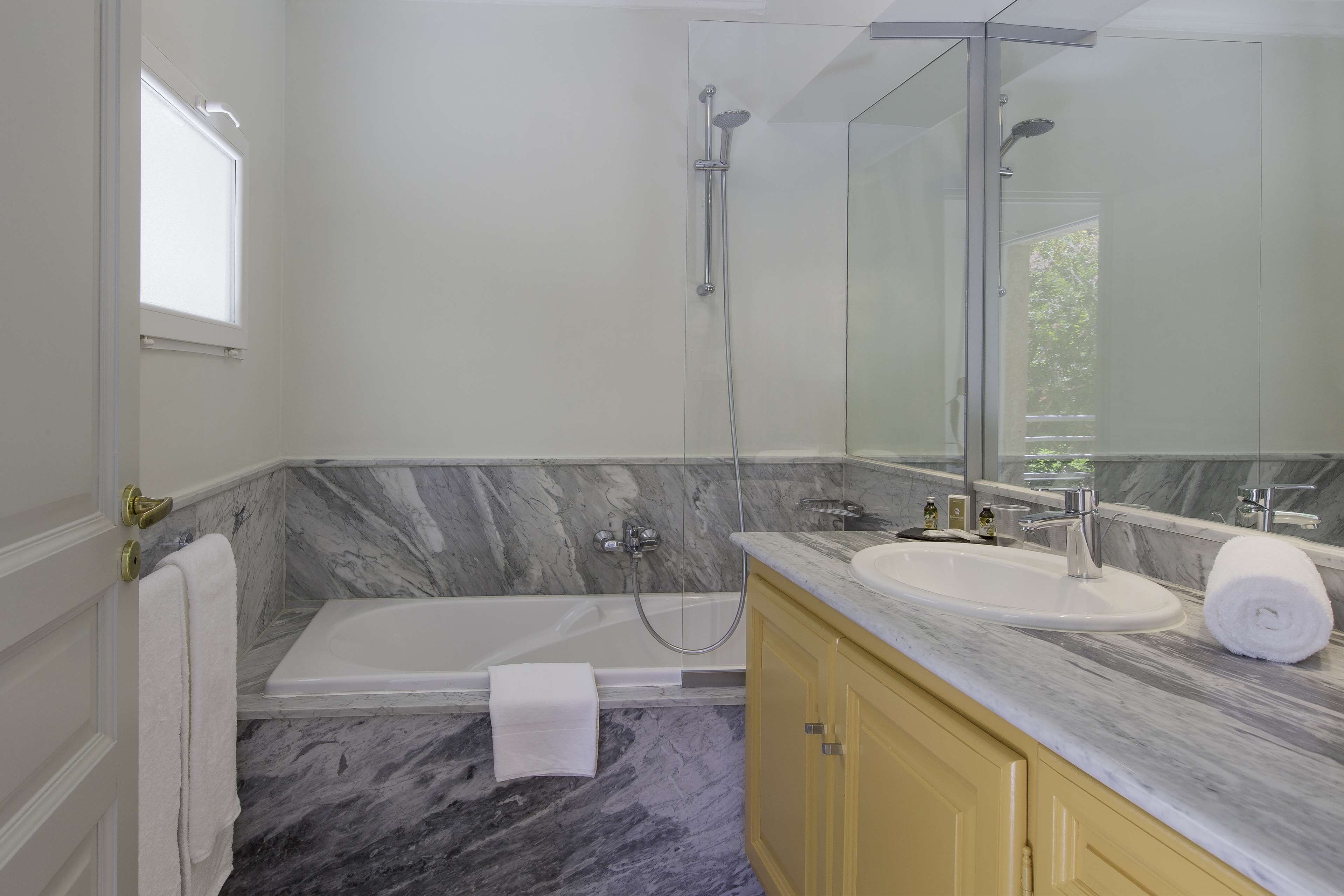 bathtub, free toiletries, hair dryer, towels