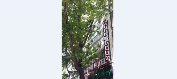 A hotel sign with the name "Hotel Abro" and a green sign below it that reads "Agahbew". - Hotel Abro Necatibey (Ankara)