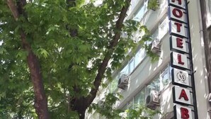 A hotel sign with the name "HOTEL ABRO" and a restaurant sign below it named "Agahney". - Hotel Abro Necatibey (Ankara)