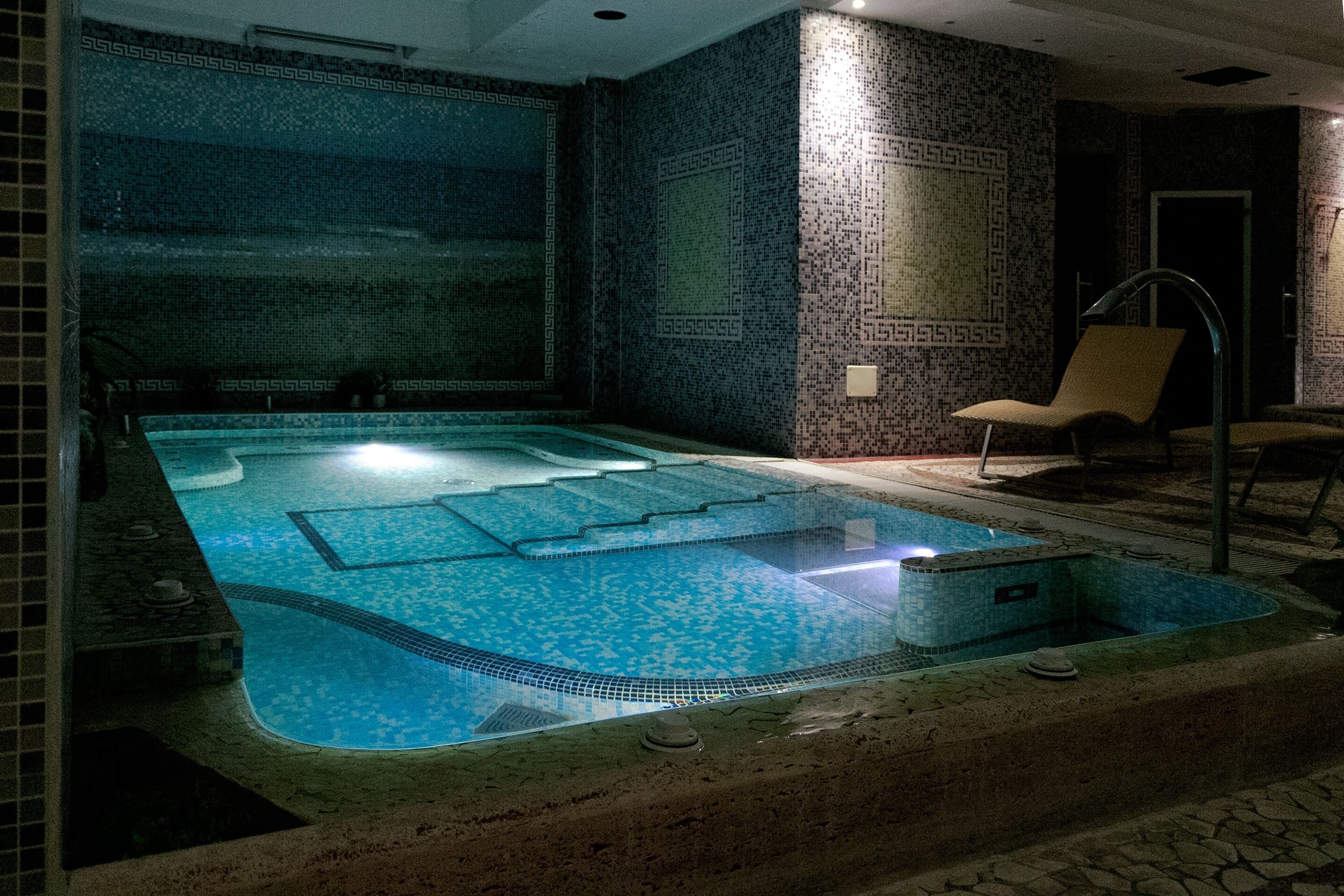 A spa area with a hot tub and a seating area.