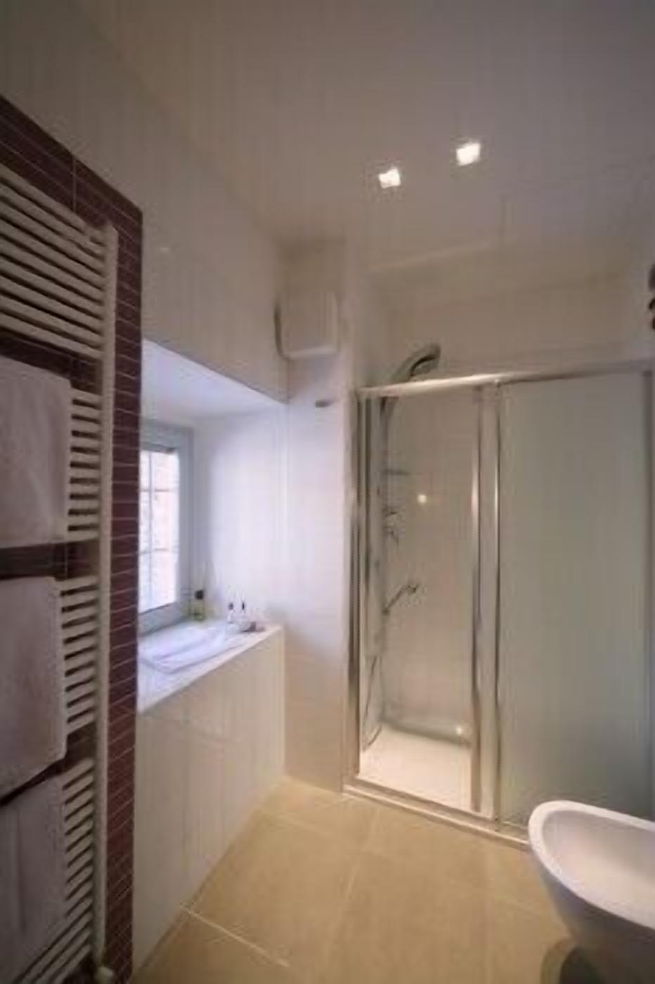 junior suite | bathroom | shower, free toiletries, hair dryer, slippers