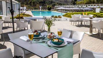 Indoor pool, seasonal outdoor pool, pool umbrellas, pool loungers