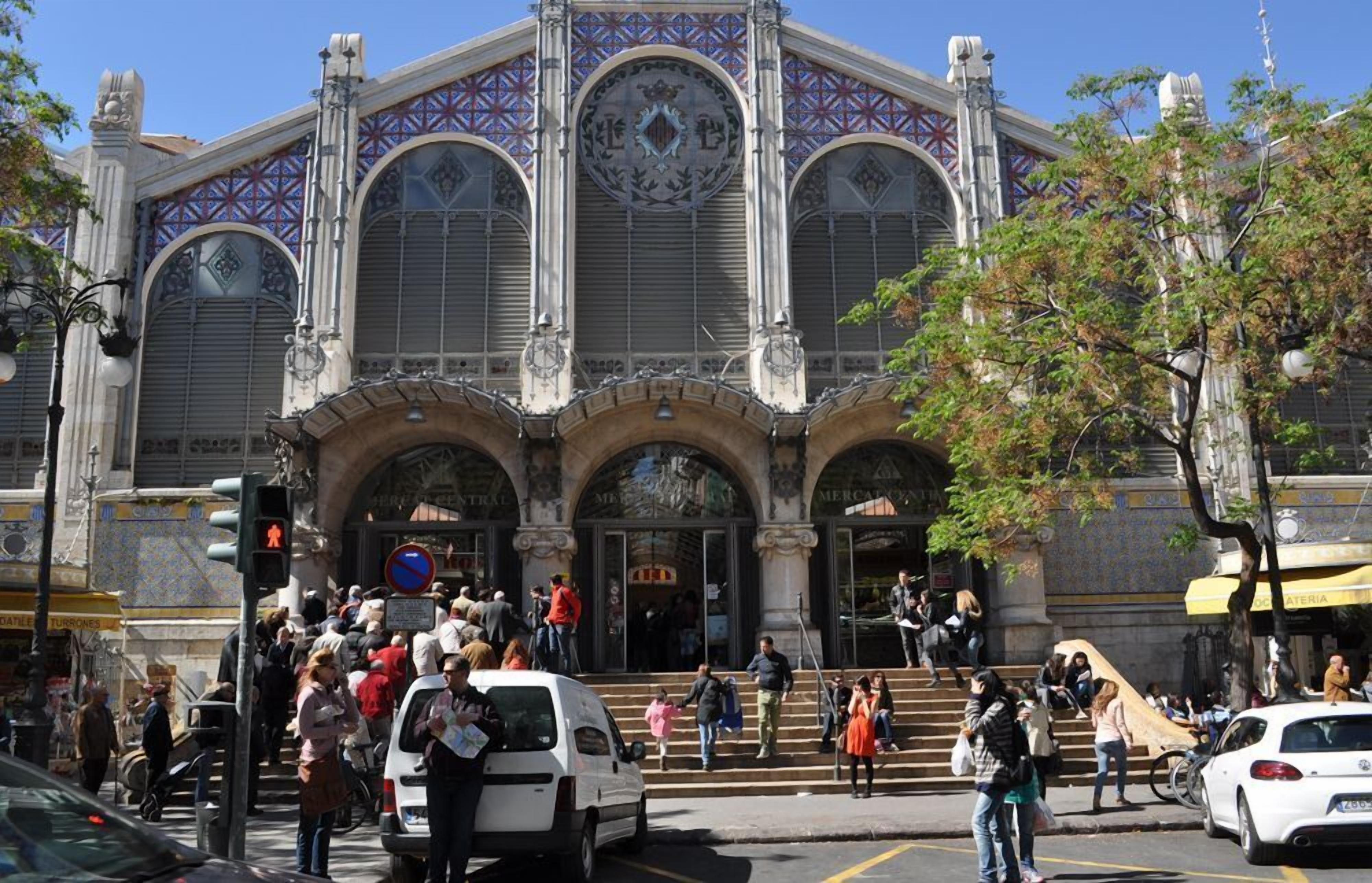 A historic building with ornate architecture, large arched windows, and a prominent entrance.