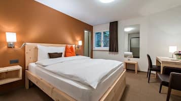 Premium bedding, down comforters, pillowtop beds, in-room safe